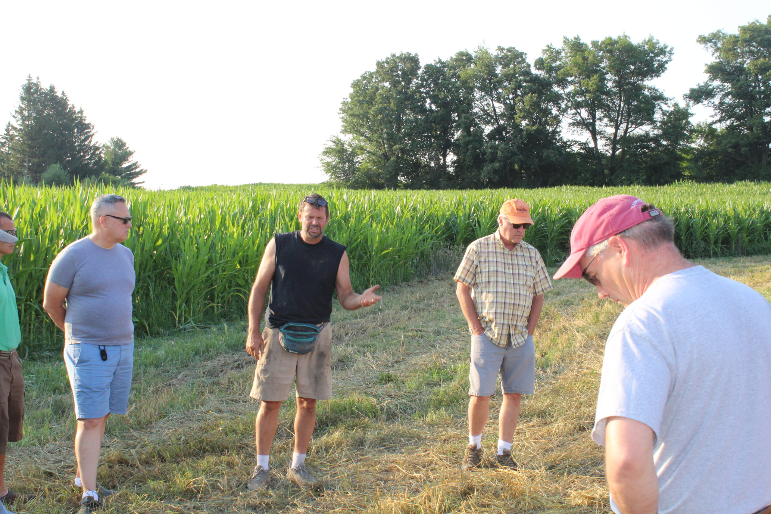 Dairy and grain farmer Greg Friendshuh talks with participants at a Western Wisconsin Conservation Council field day in July at his farm in Clear Lake. 